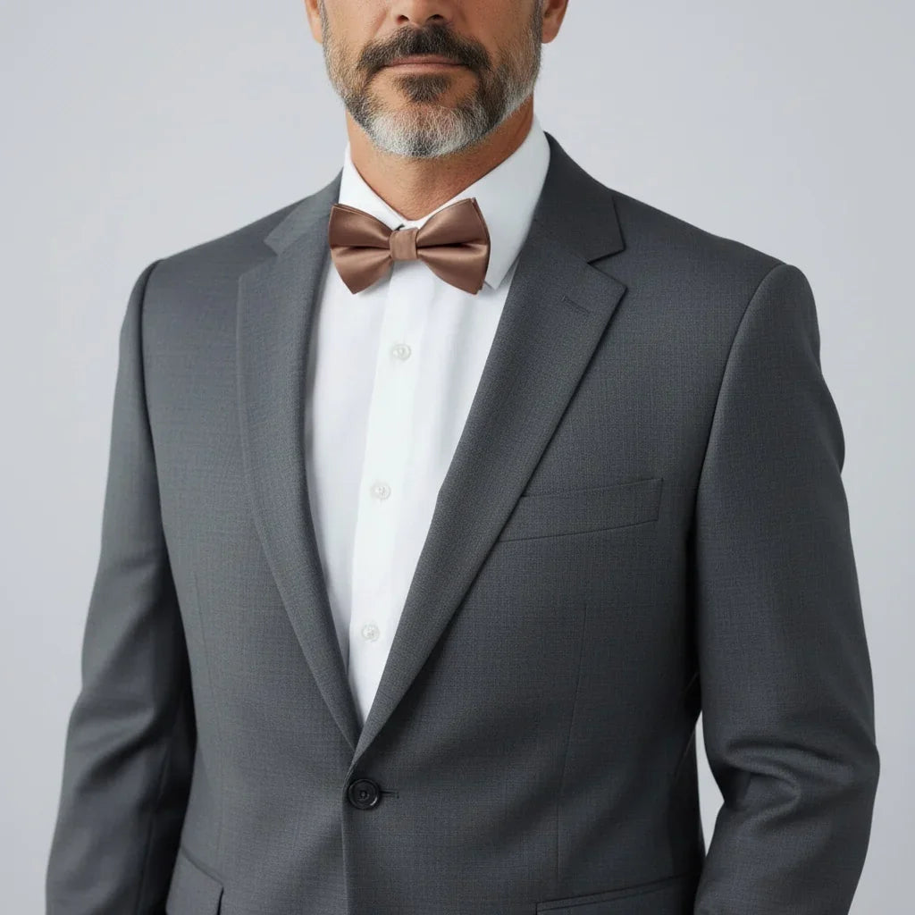 Groomsman wearing a taupe bowtie for men.