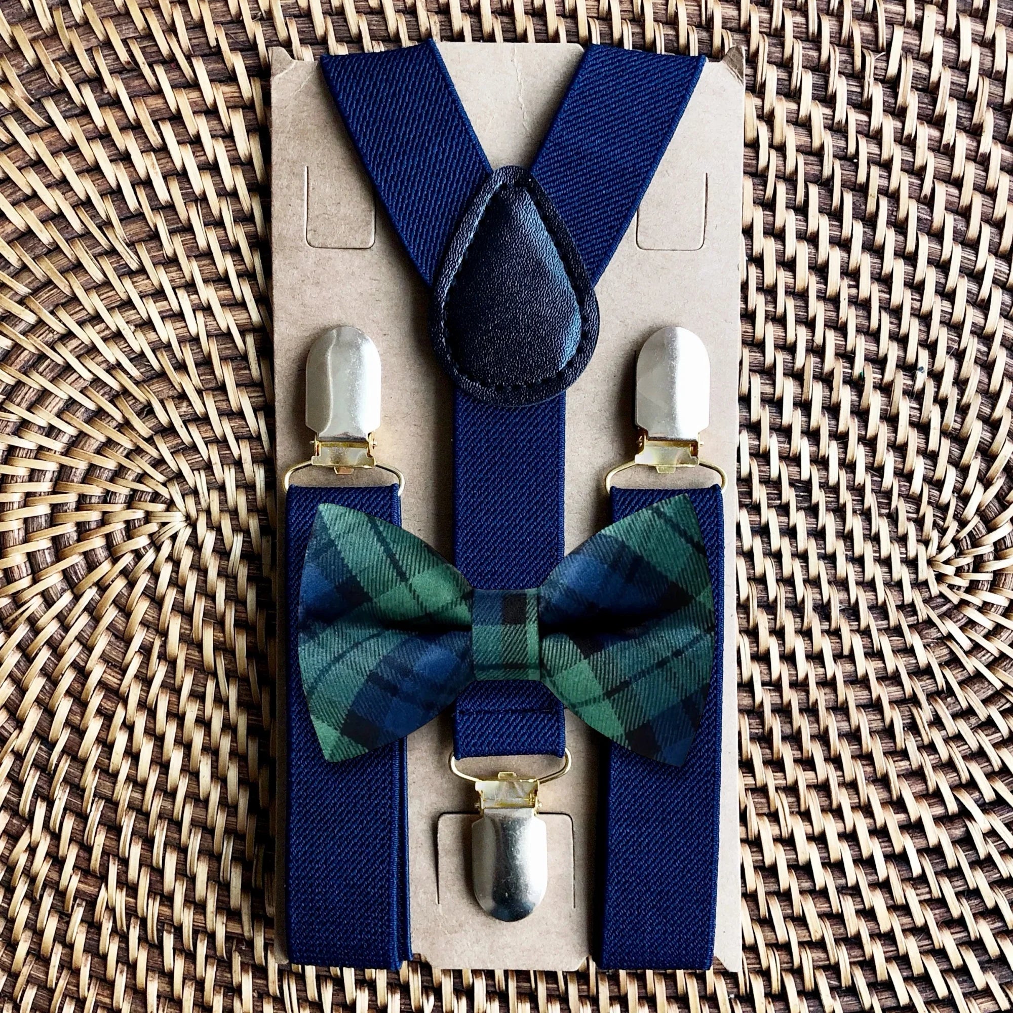 Plaid bow tie and suspenders in navy and green.