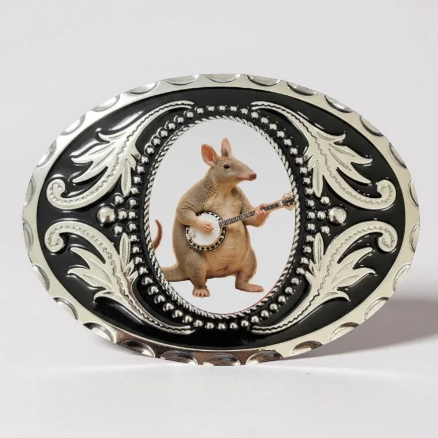 Anteater belt buckle with an anteater playing a banjo.