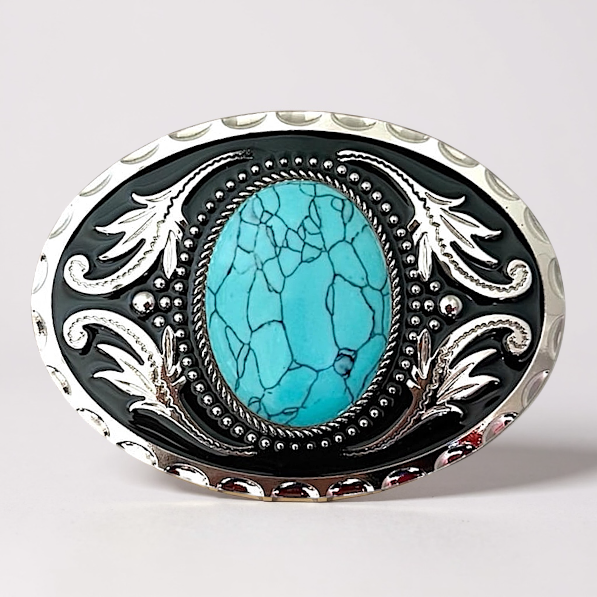 Belt buckle with turquoise stone and silver detailing on a light gray background