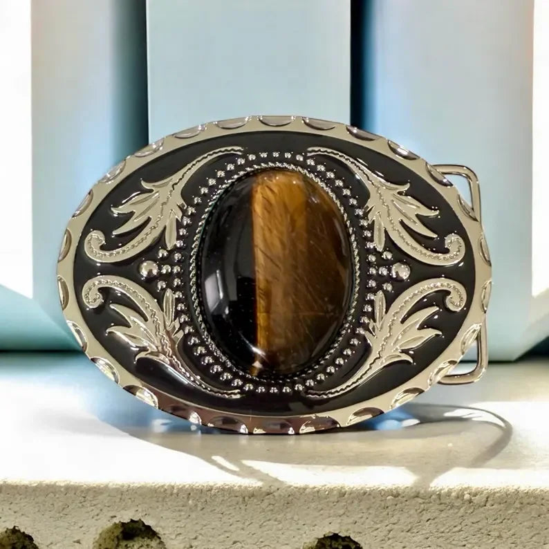 Tiger's Eye belt buckle with a stone center on a neutral background