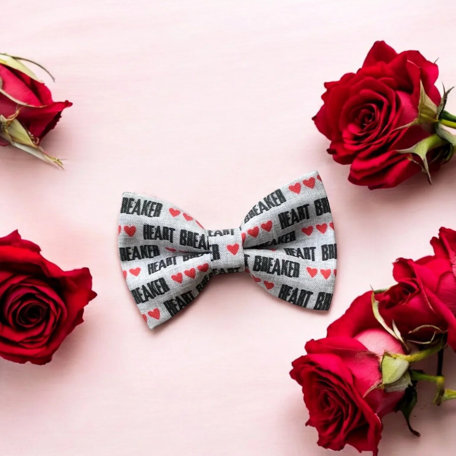 Size chart for pre-tied bow ties from The Bold Bow Tie detailing measurements across three sizes. Small is 3.5 inches wide and recommended for ages 6 months to 5 years. Medium is 4 inches wide and recommended for ages 6 to 12 years. Large is 4.5 inches wide and recommended for ages 13 years and up. Visual icons illustrate the relative sizes with horizontal arrows showing that width is measured from wingtip to wingtip. Bottom text notes that all bow ties are pre-tied and ready to add to your outfit.