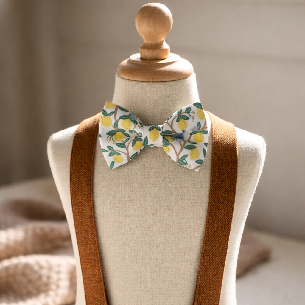 Close-up of a high-quality ivory lemon patterned bow tie for groom wedding attire featuring 30 years of American-made artisan craftsmanship.