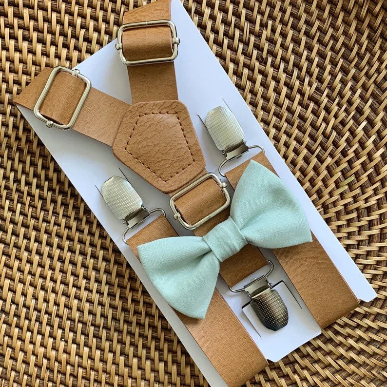 Size chart for suspender and bow tie sets from The Bold Bow Tie. Small (6mo-4yr): 16"-27" suspenders, 3.5" bow. Medium (5-10yr): 20"-32" suspenders, 4" bow. Large (10-18yr): 24"-47" suspenders, 4.5" bow. Adult (Up to 6ft): 27"-55" suspenders, 4.5" bow. Big & Tall (Over 6ft): Up to 63" suspenders, 4.5" bow. Instructions note to measure from the back waistband over the shoulder to the front waistband for a comfortable fit.