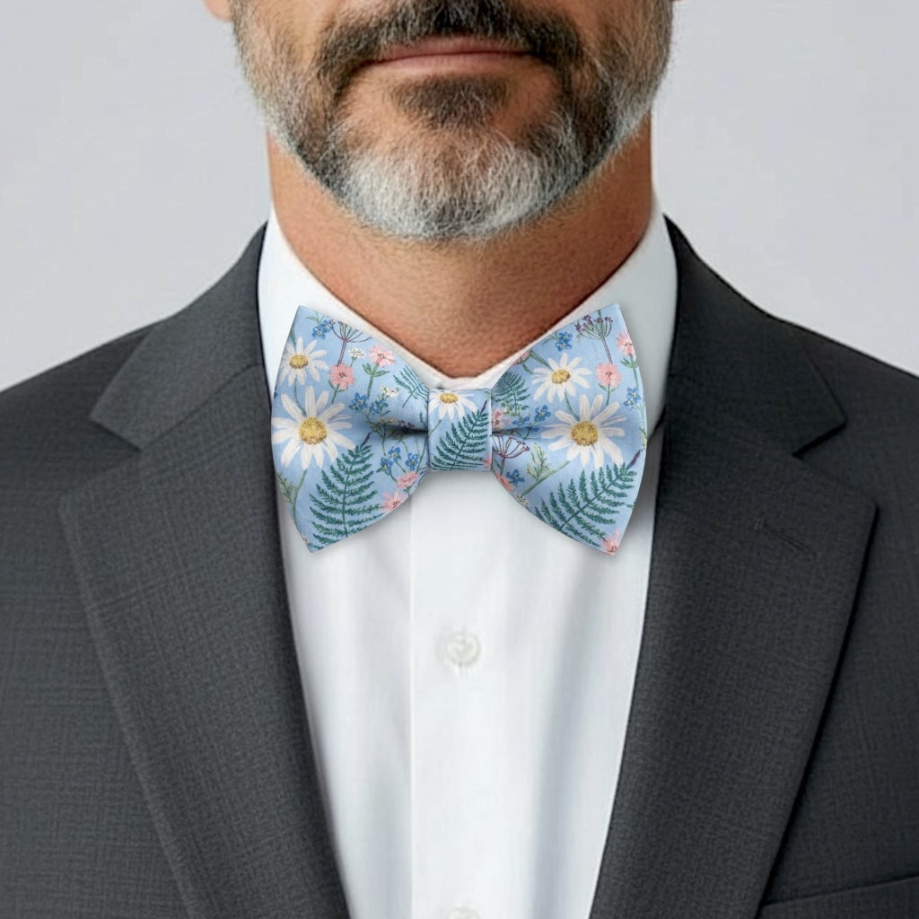 Groomsman in a dusty blue wildflower bow tie.