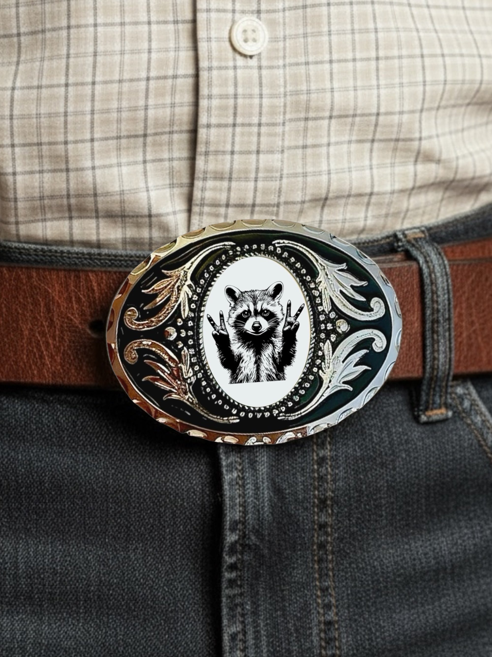 Raccoon Belt for men with a decorative buckle featuring a raccoon design, worn by a cowboy in a plaid shirt and jeans.