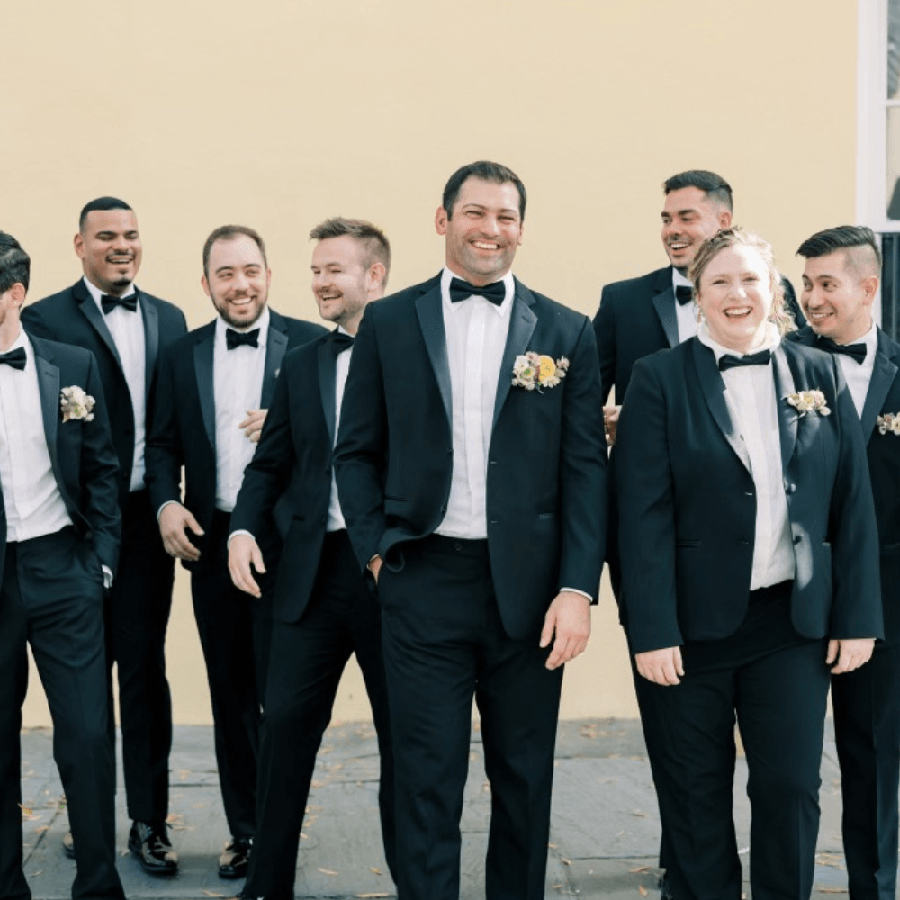 Groom and groomsmen in black bow ties