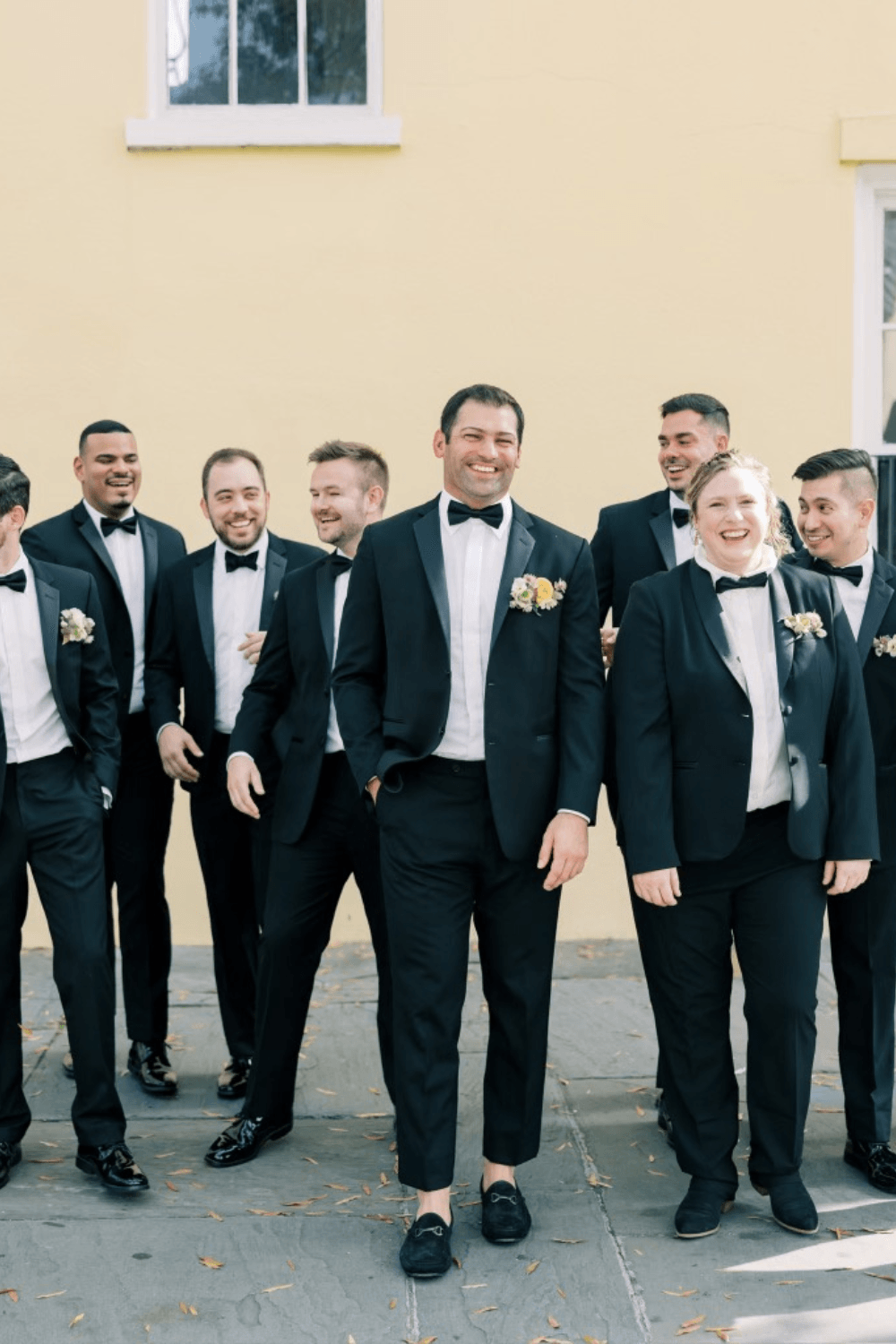 Groom and groomsmen in black bow ties