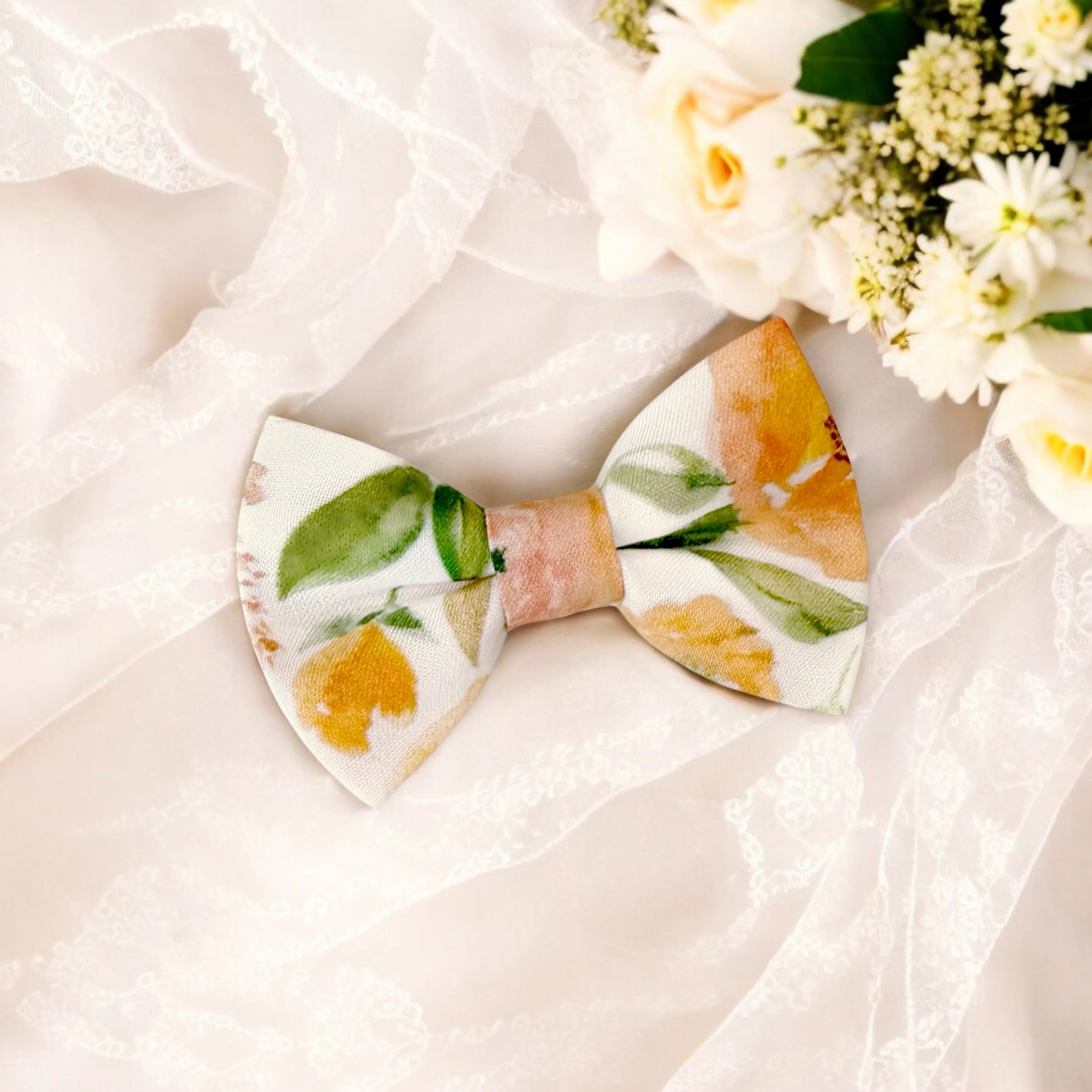 Size chart for pre-tied bow ties from The Bold Bow Tie detailing measurements across three sizes. Small is 3.5 inches wide and recommended for ages 6 months to 5 years. Medium is 4 inches wide and recommended for ages 6 to 12 years. Large is 4.5 inches wide and recommended for ages 13 years and up. Visual icons illustrate the relative sizes with horizontal arrows showing that width is measured from wingtip to wingtip. Bottom text notes that all bow ties are pre-tied and ready to add to your outfit.