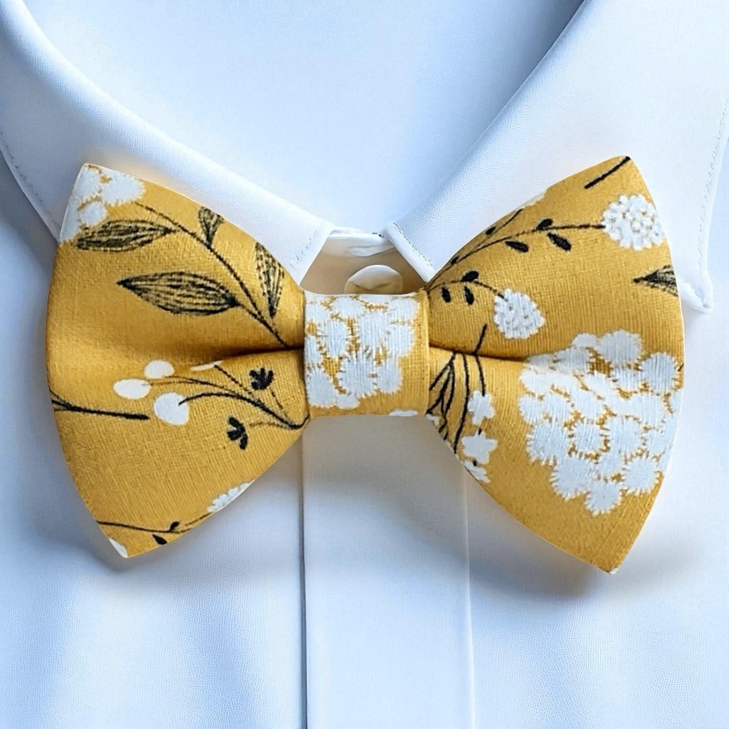 Yellow floral bow tie on a white background