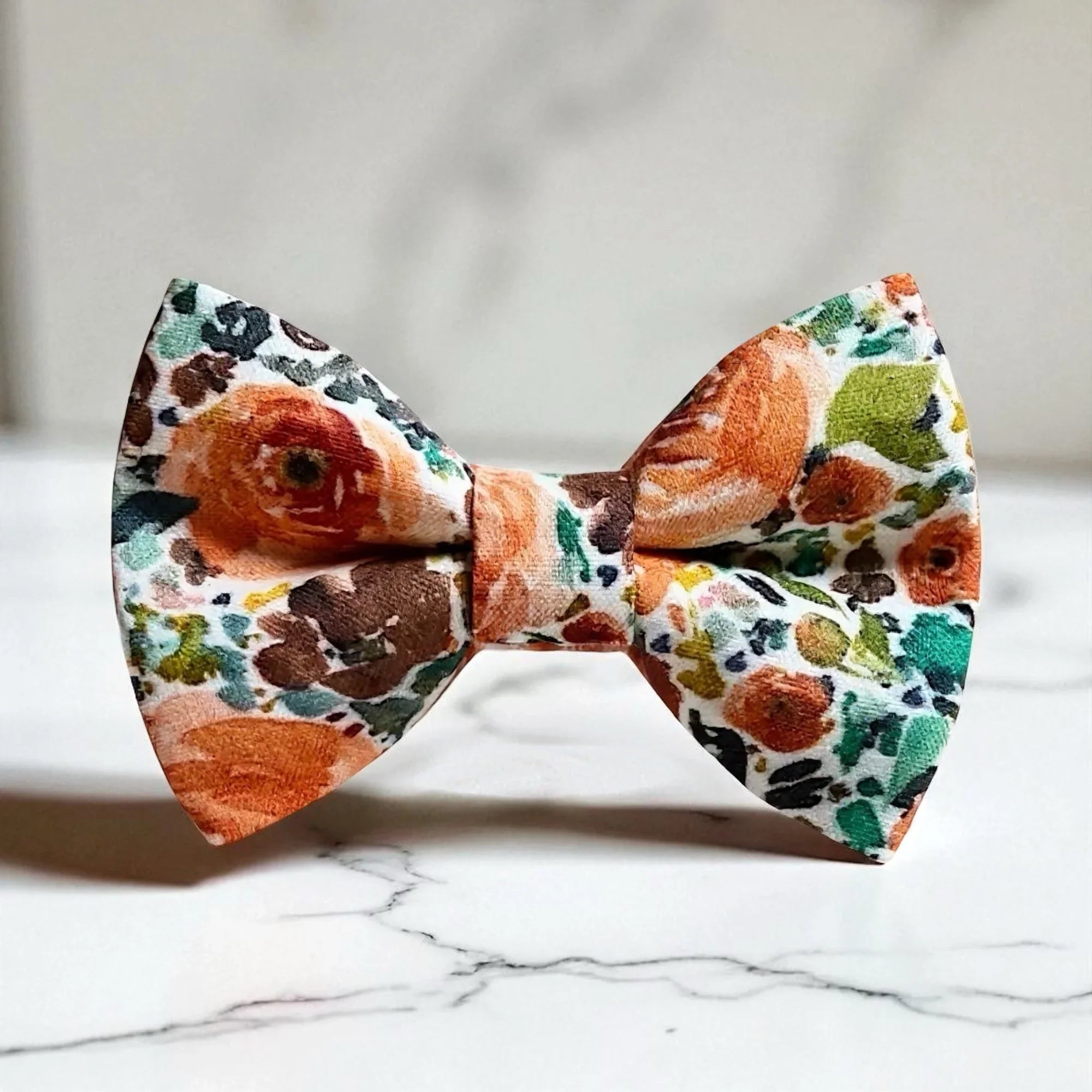 Orange floral bow tie for men, weddings and groomsmen, on a white background