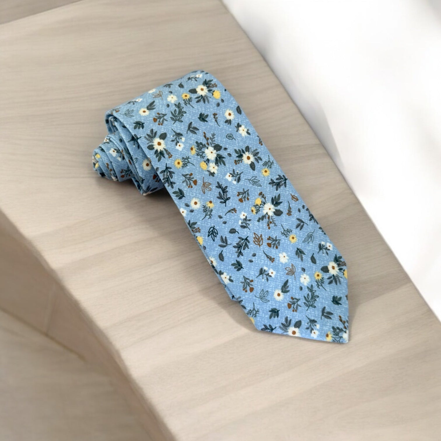 Blue and white floral men’s tie for wedding.