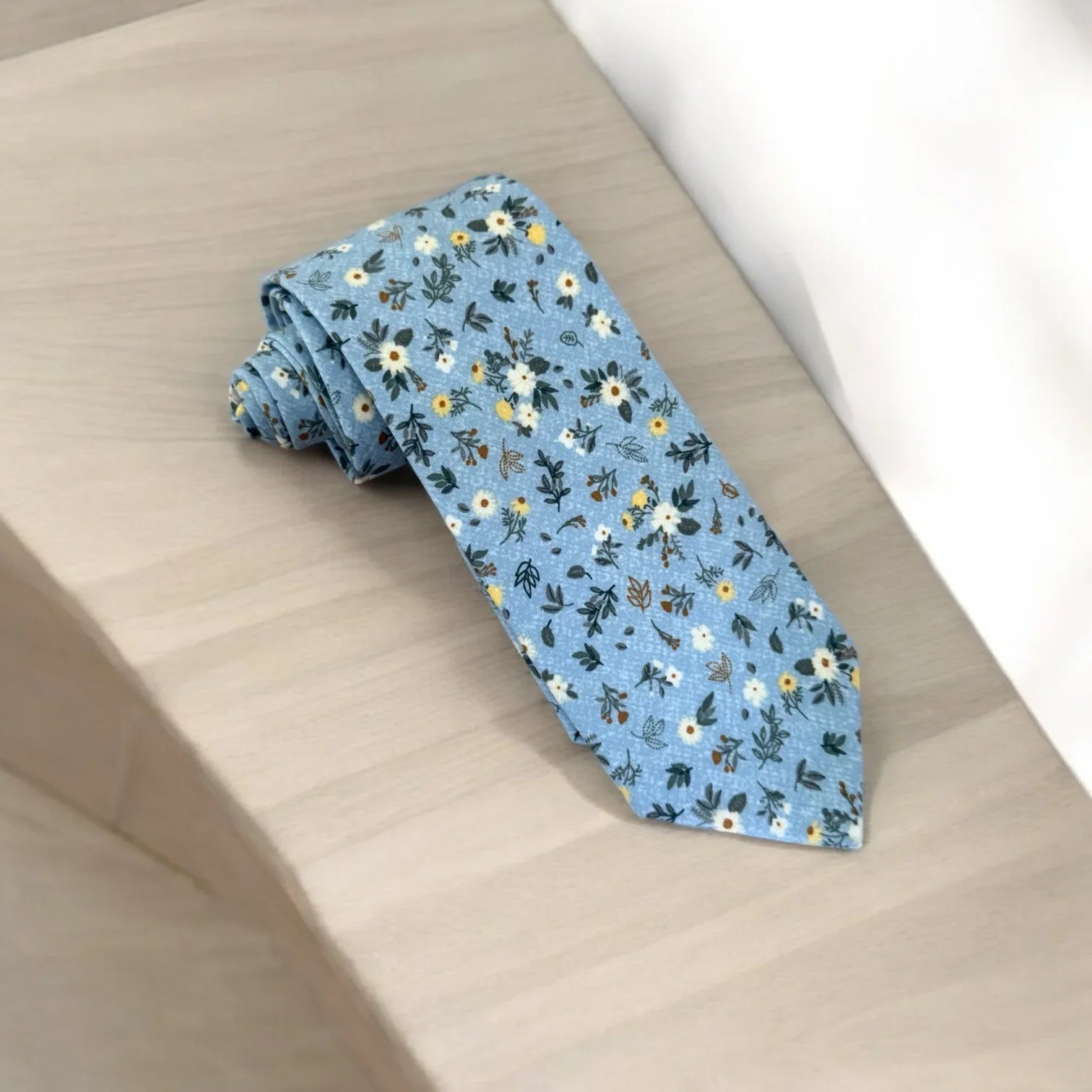 Blue and white floral men’s tie for wedding.