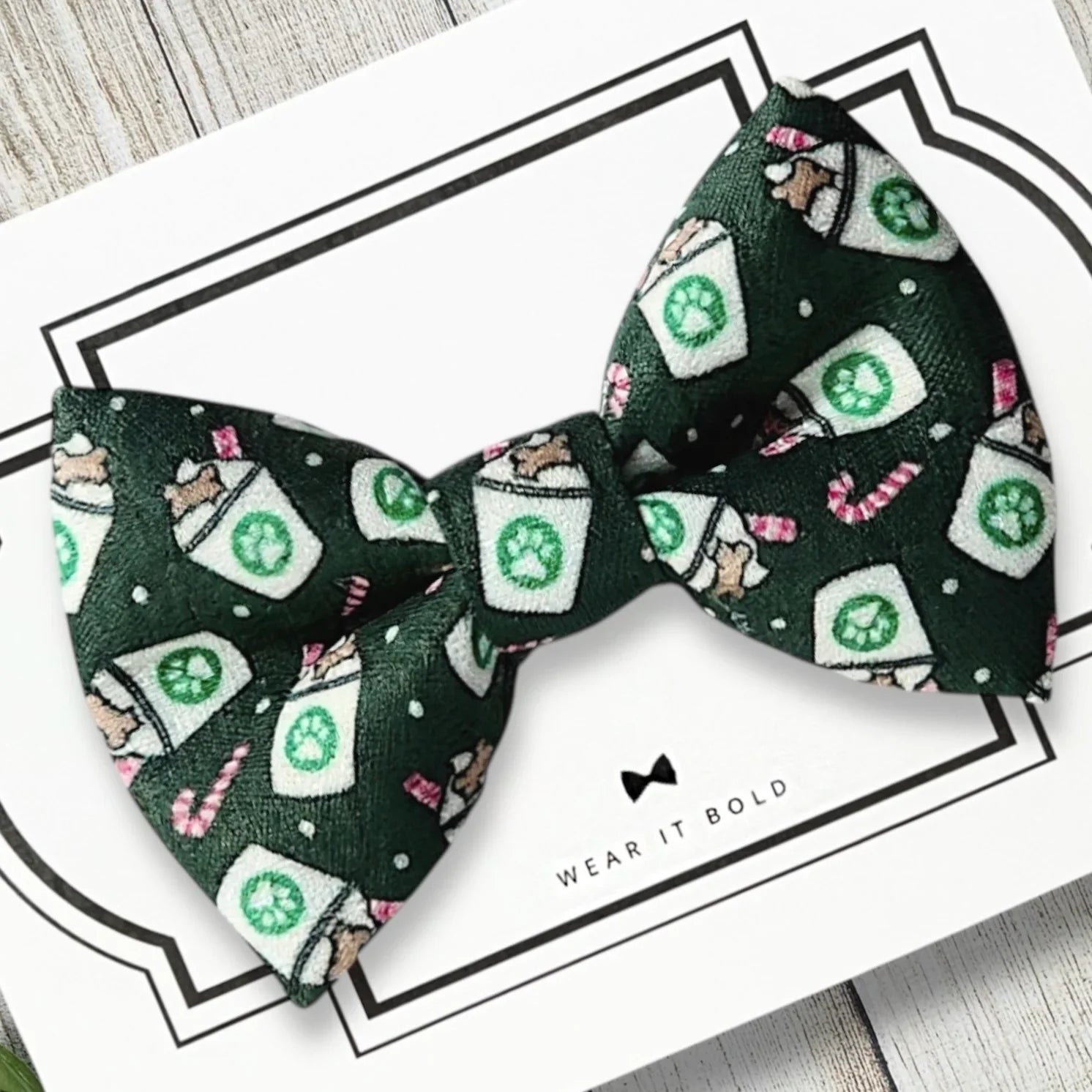 Dark green Christmas bow tie with white coffee cup patterns for a dog collar on a white card