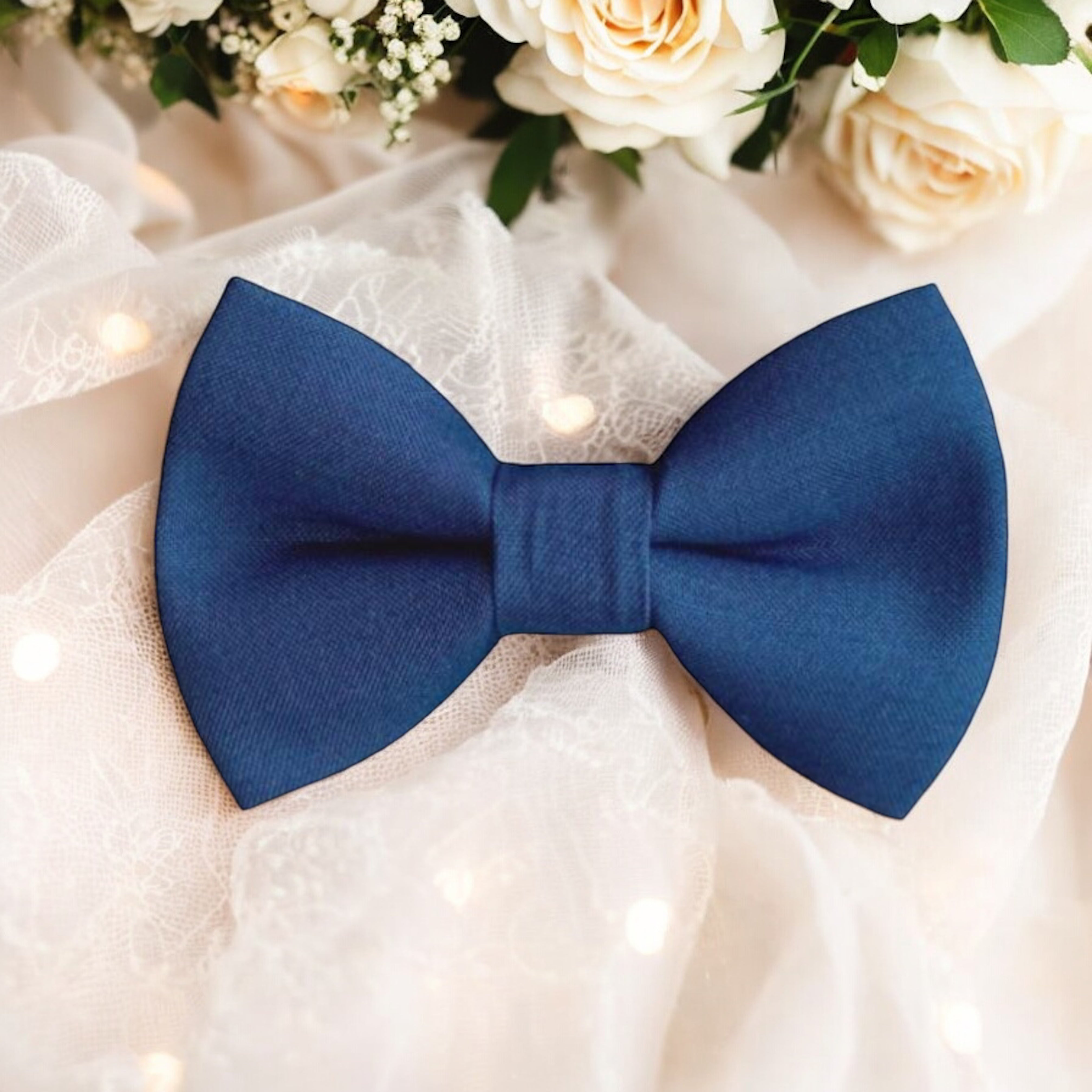 Slate Blue Bow Tie for wedding, groomsmen and ring bearers on lace surrounded by roses.