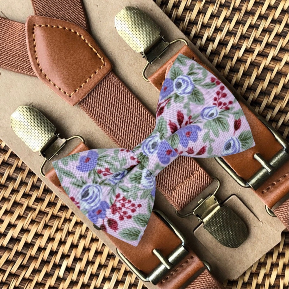 Lavender floral bow tie and suspenders set for wedding groomsmen and ring bearer outfits.