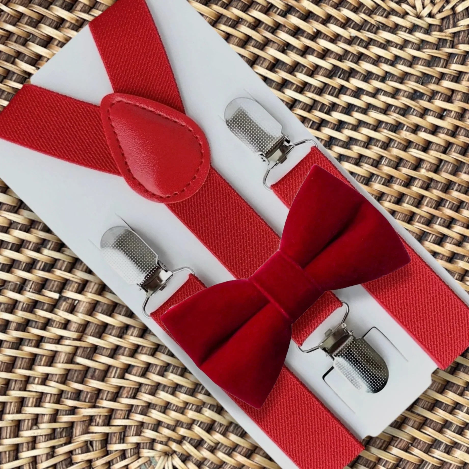 Red velvet bow tie and suspenders.