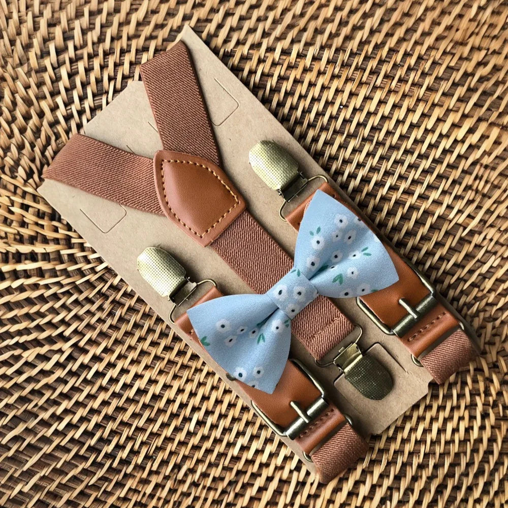 Size chart for suspender and bow tie sets from The Bold Bow Tie. X-Small (6mo-4yr): 15"-23" suspenders, 3.5" bow. Small (5-9yr): 18"-33" suspenders, 3.5" bow. Medium (10-12yr): 18"-33" suspenders, 4" bow. Adult (13yr-6'5"): 30"-53" suspenders, 4.5" bow. Big & Tall (Over 6'5"): 53"+ suspenders, 4.5" bow. Instructions note to measure from the back waistband over the shoulder to the front waistband for a comfortable fit.