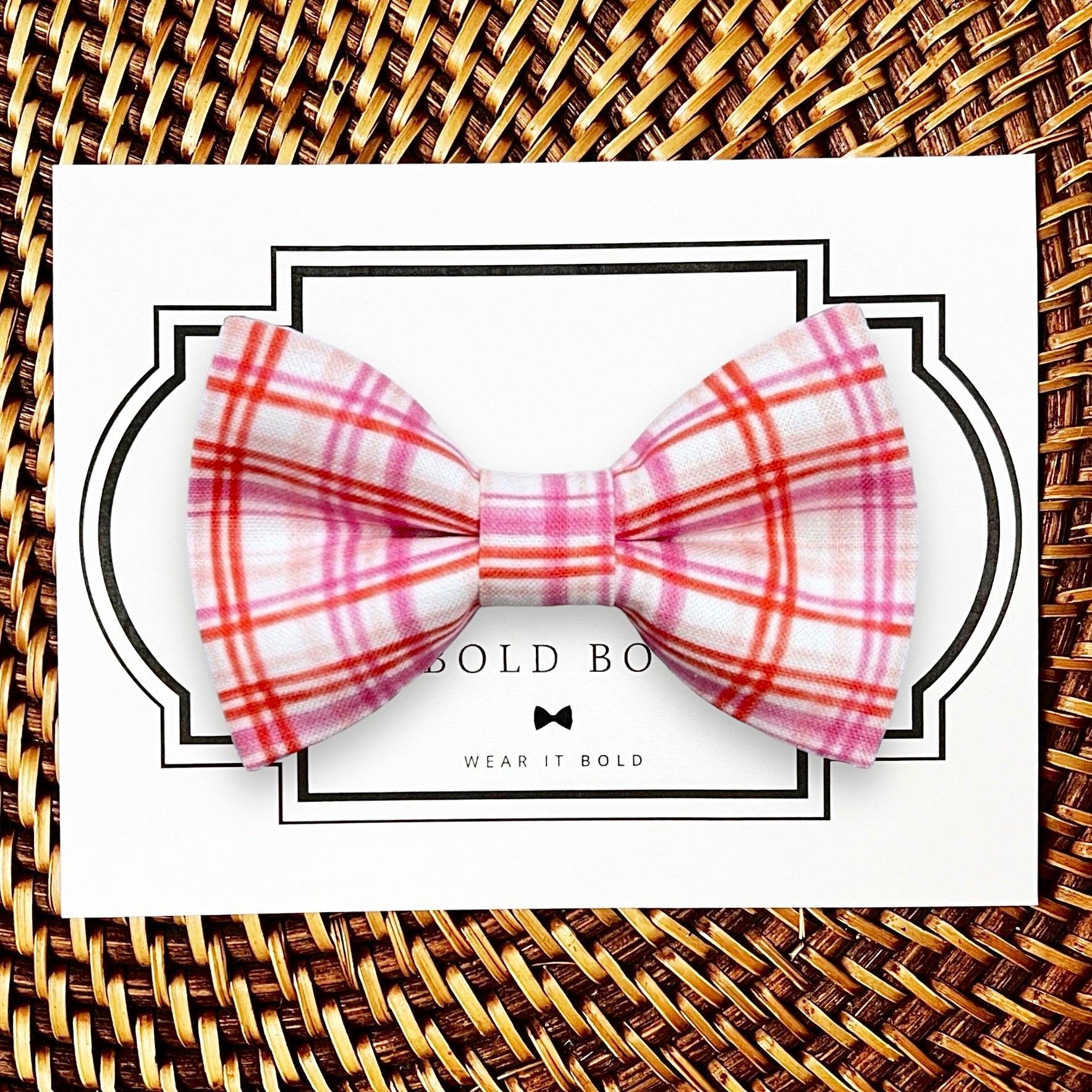 Dog bow tie size chart. Size Small is 3 1/2 inches wide for small dogs under 15 lbs. Size Medium is 4 inches wide for medium dogs between 15 band 40 lbs. Size Large is 4 1/2 inches wide for Large Dogs between 40 band 80 lbs. Size Extra Large is 5 1/2 inches wide for Extra Large Dogs over 80 lbs. Sizing is up to preference and pet bow ties slide on to dog collars with elastic.