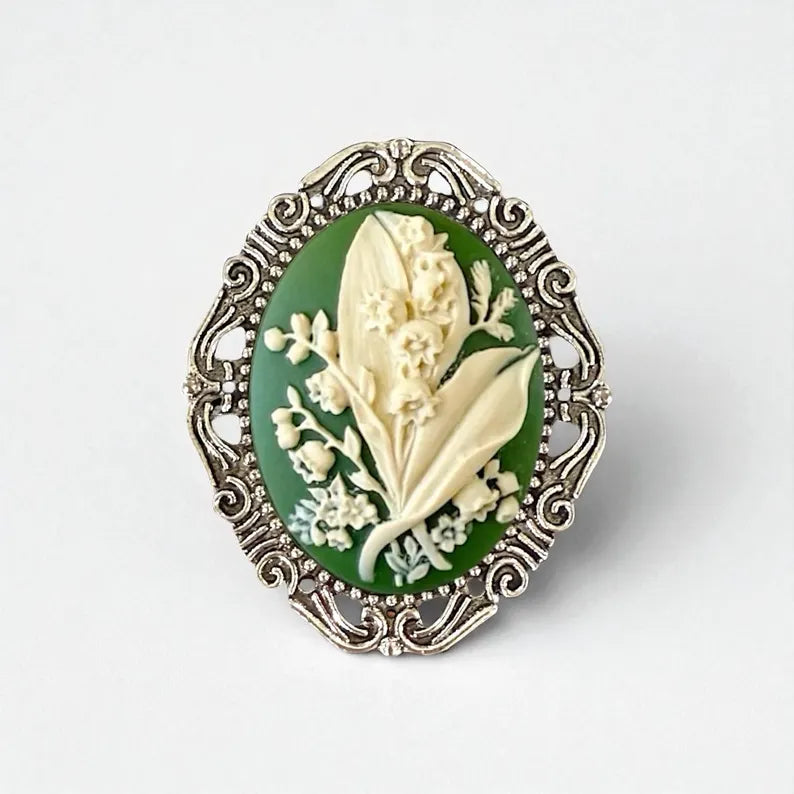Decorative brooch with floral design on a white background