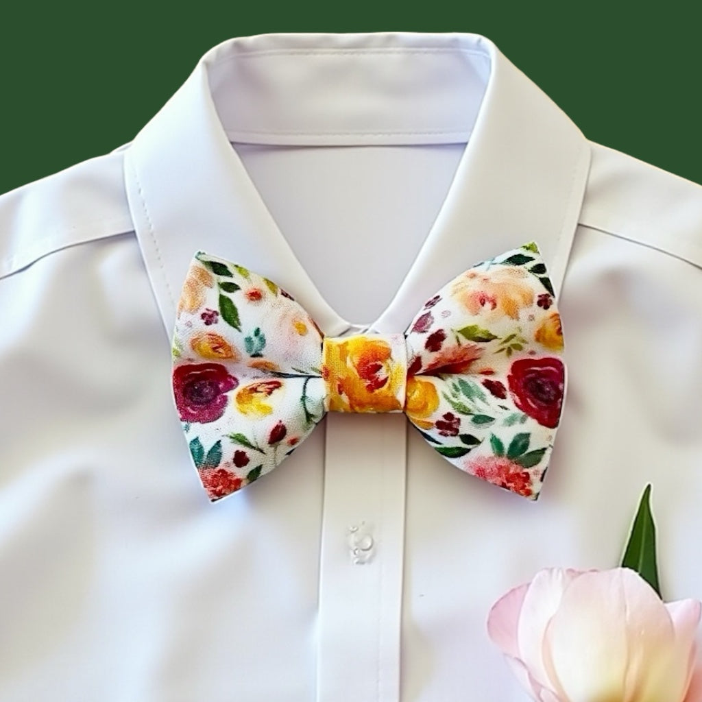 Floral bow tie on a white shirt with a green background