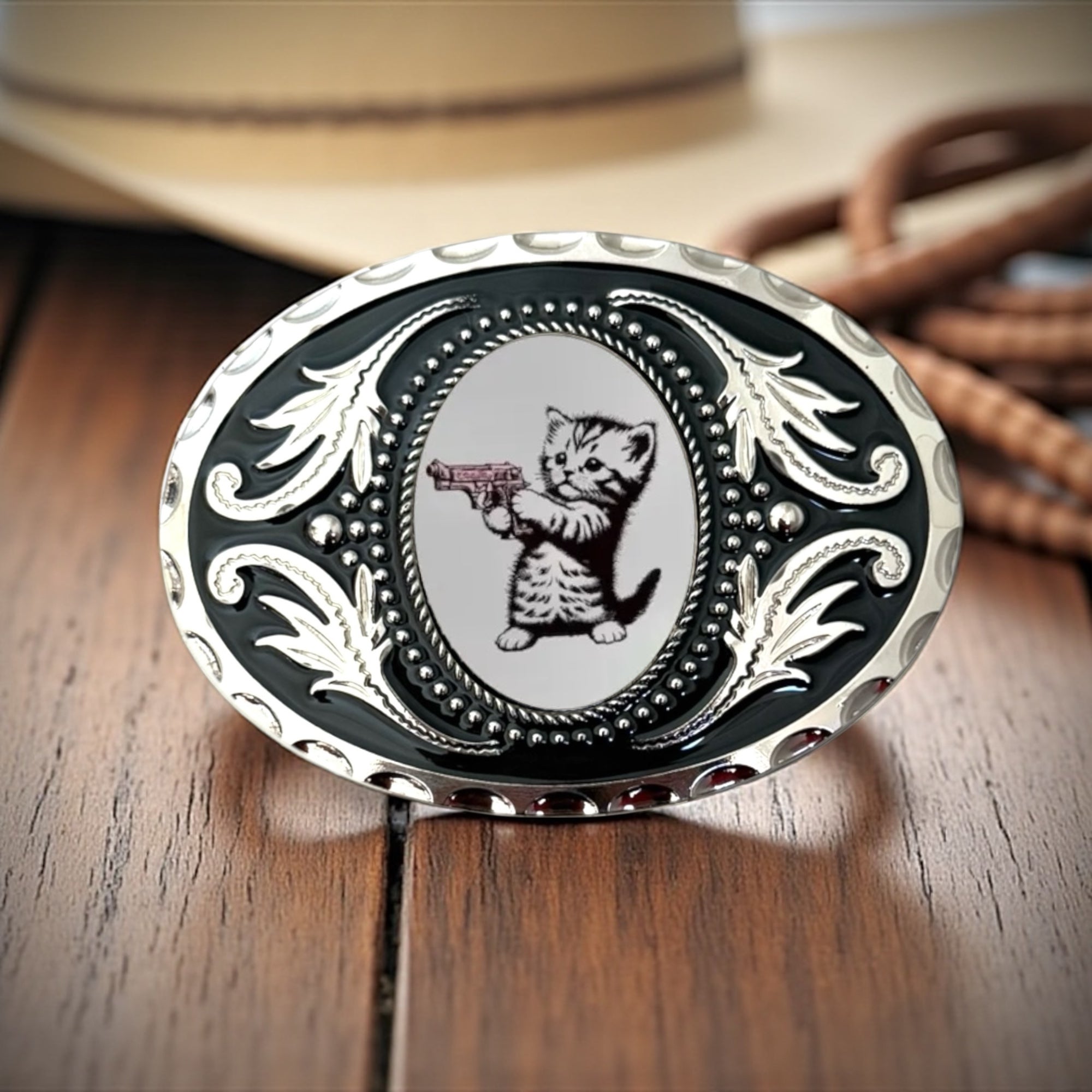 Kitten Belt Buckle Western Accessory in front of a Cowboy hat