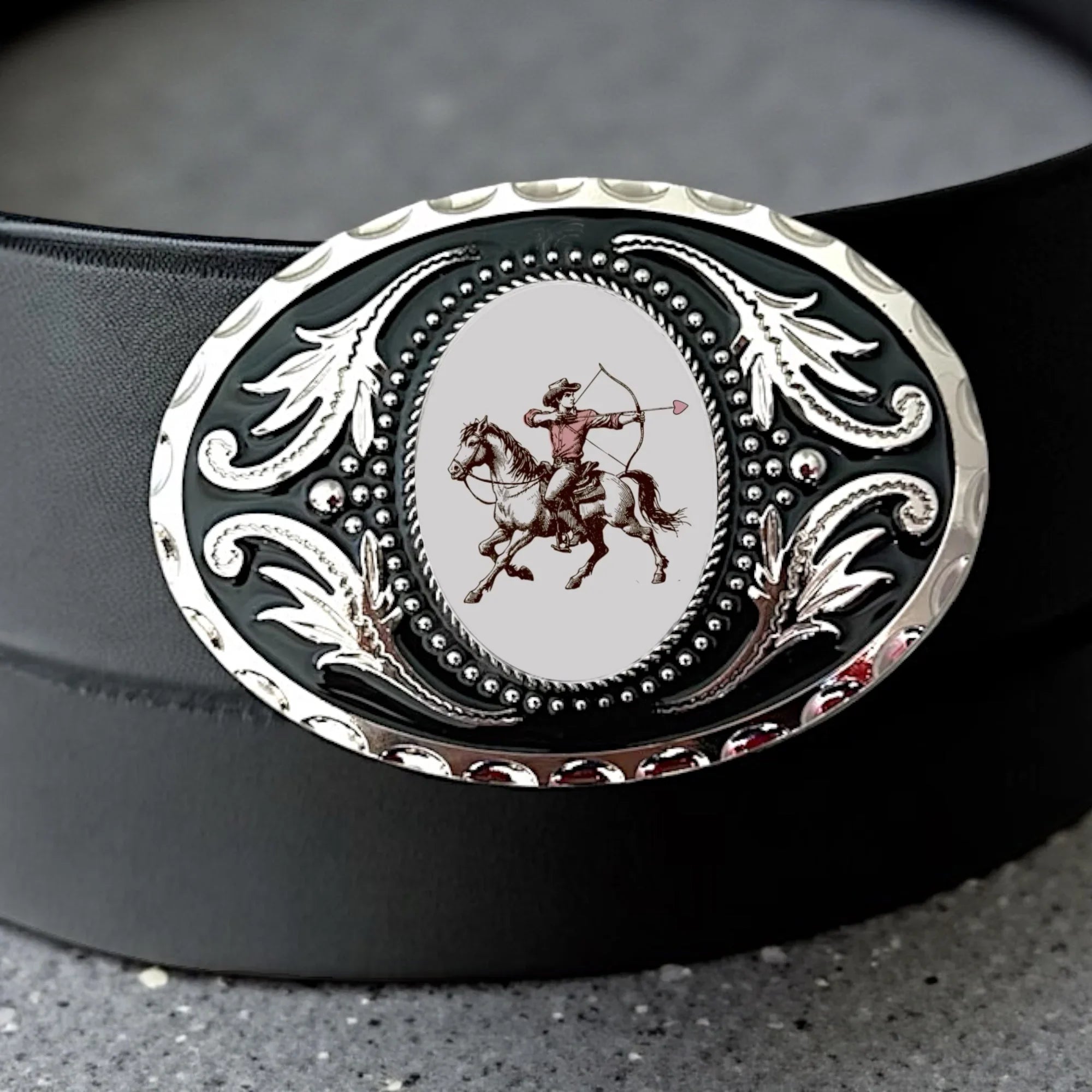 Two options for belt buckles: Option 1 has a leaf pattern and option 2 has flowers on it