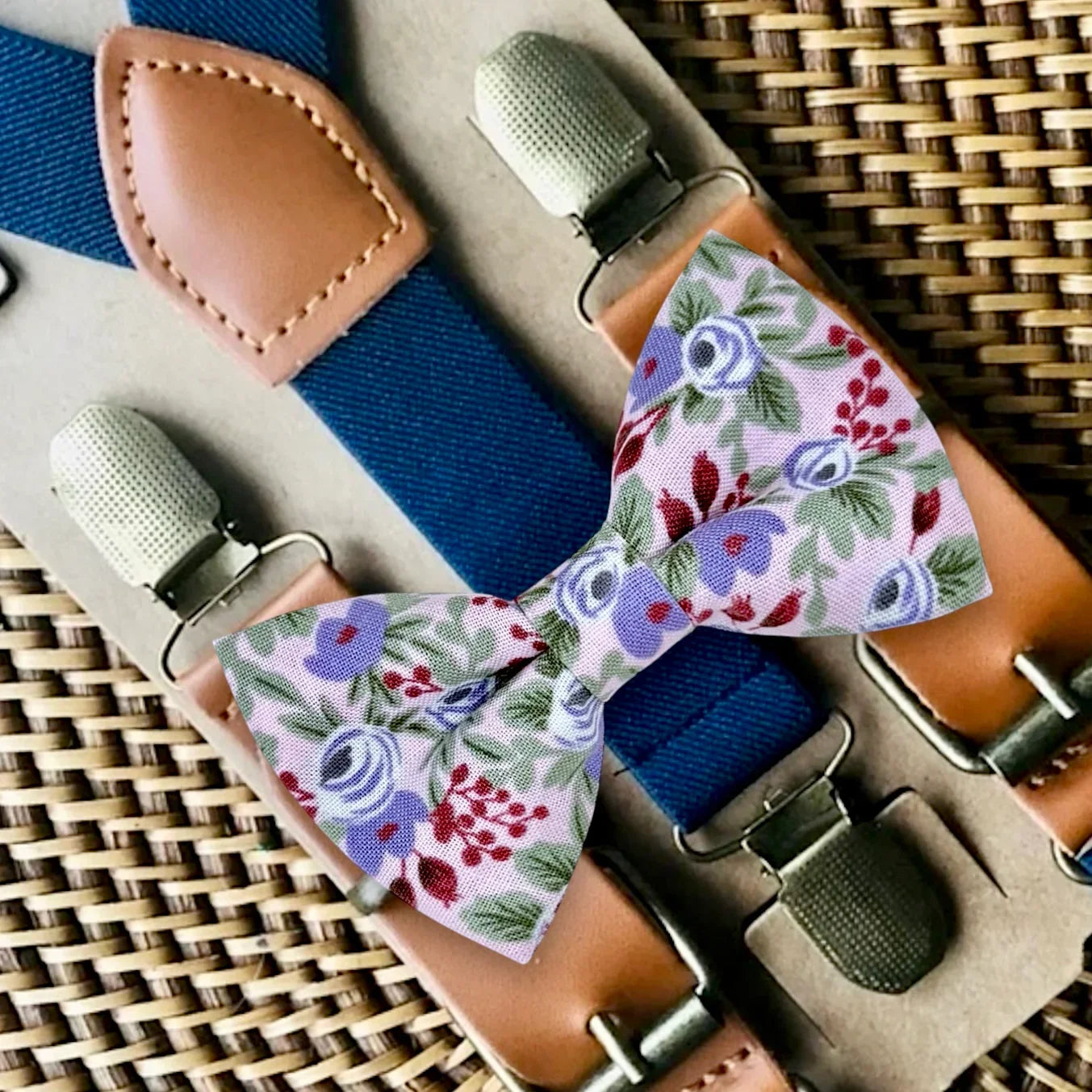Purple floral bow tie and navy blue suspenders for wedding.