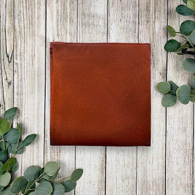Burnt orange pocket square in terracotta fabric for men groomsmen and weddings.