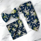 Navy blue and white floral men’s tie, bow tie and pocket square for wedding.