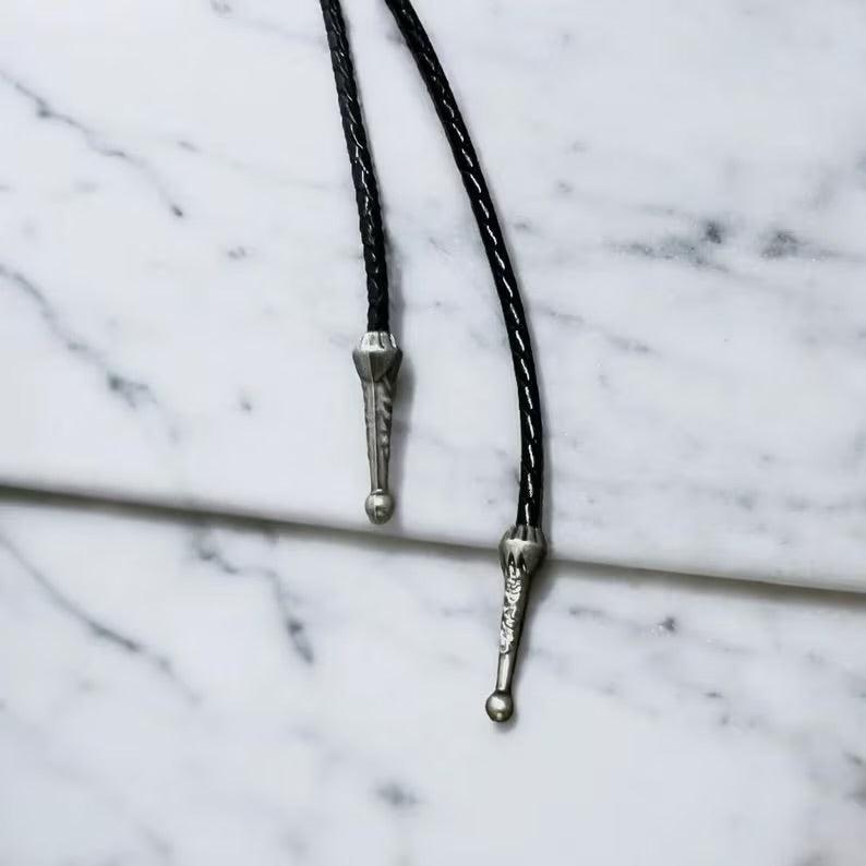 Closeup of silver tassels