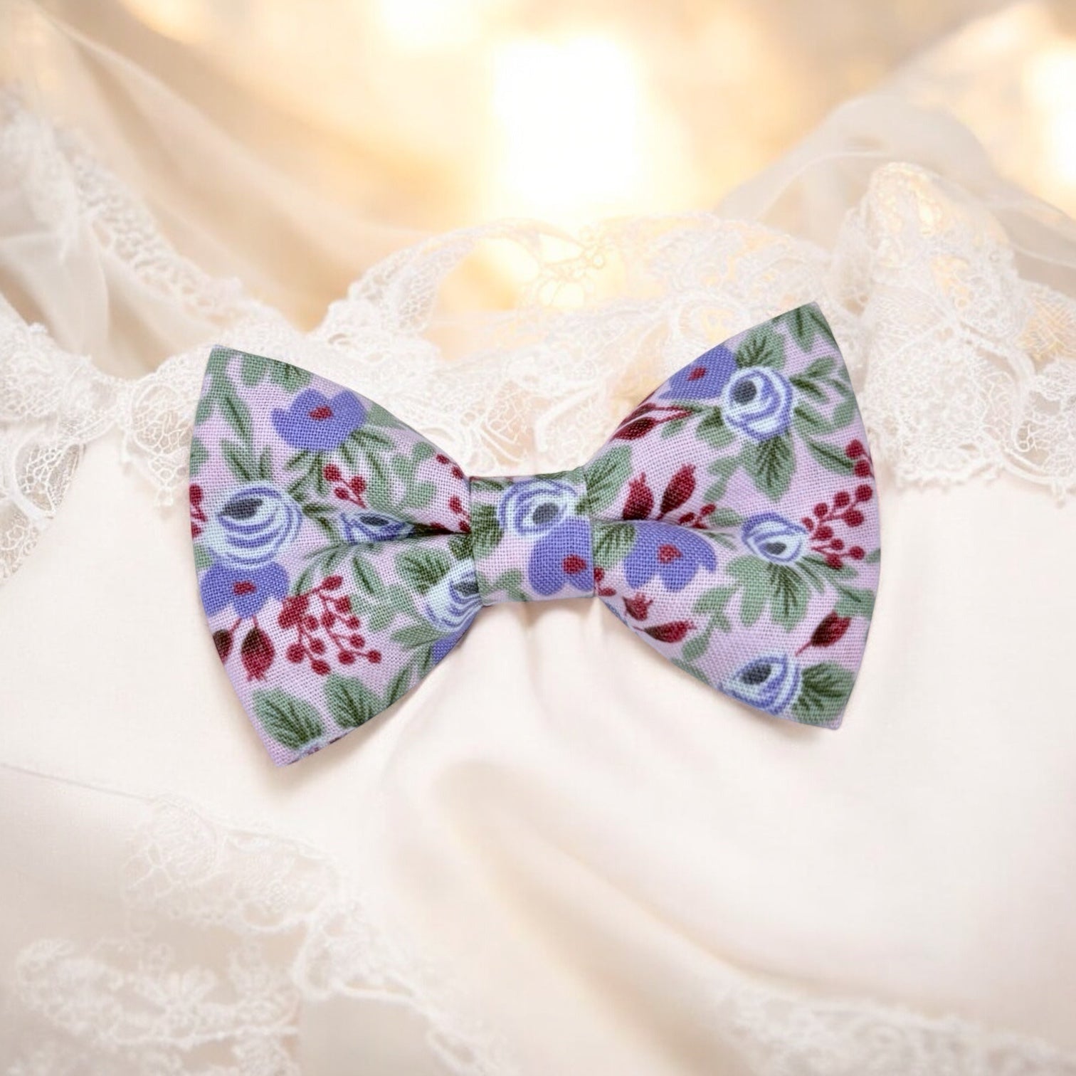 Lavender floral patterned bow tie on a white background for weddings groomsmen and ring bearers.