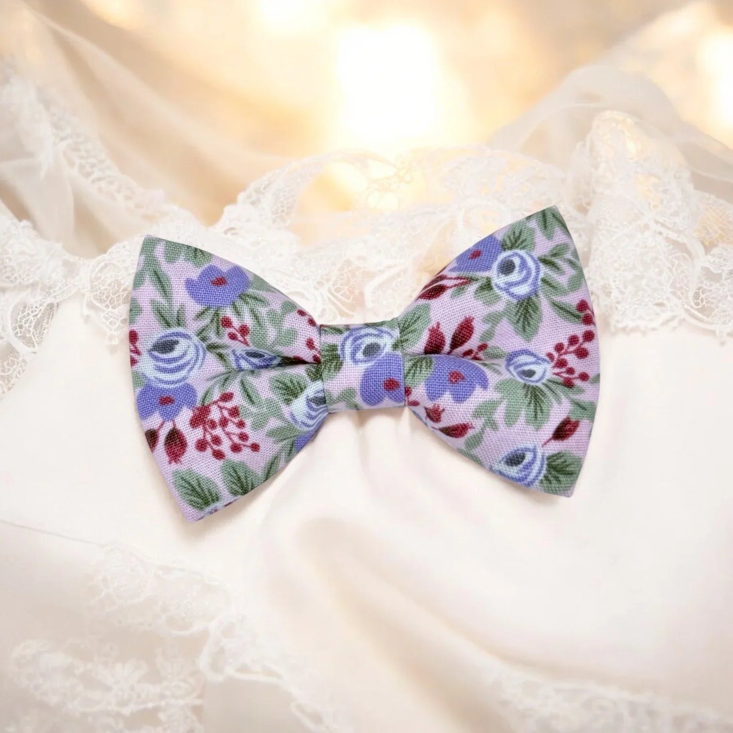 Lavender floral patterned bow tie on a white background for weddings groomsmen and ring bearers.