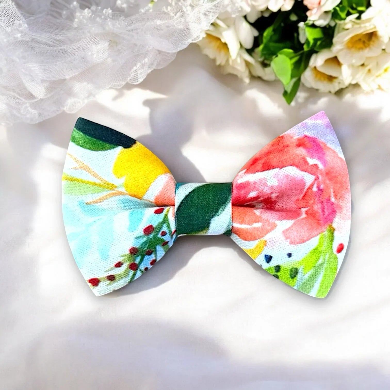 Colorful floral bow tie on a white background