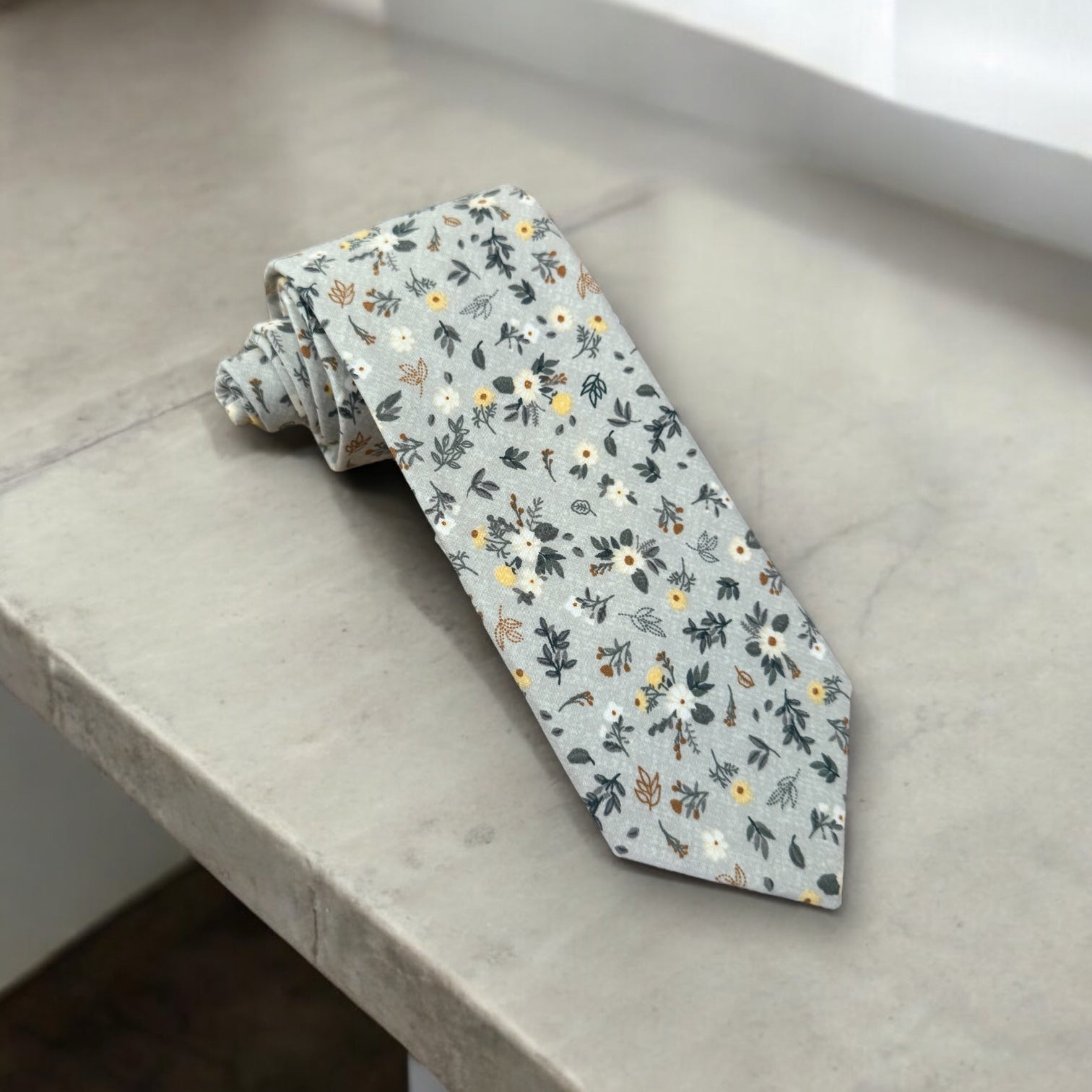 Light blue and white floral men’s tie for wedding.
