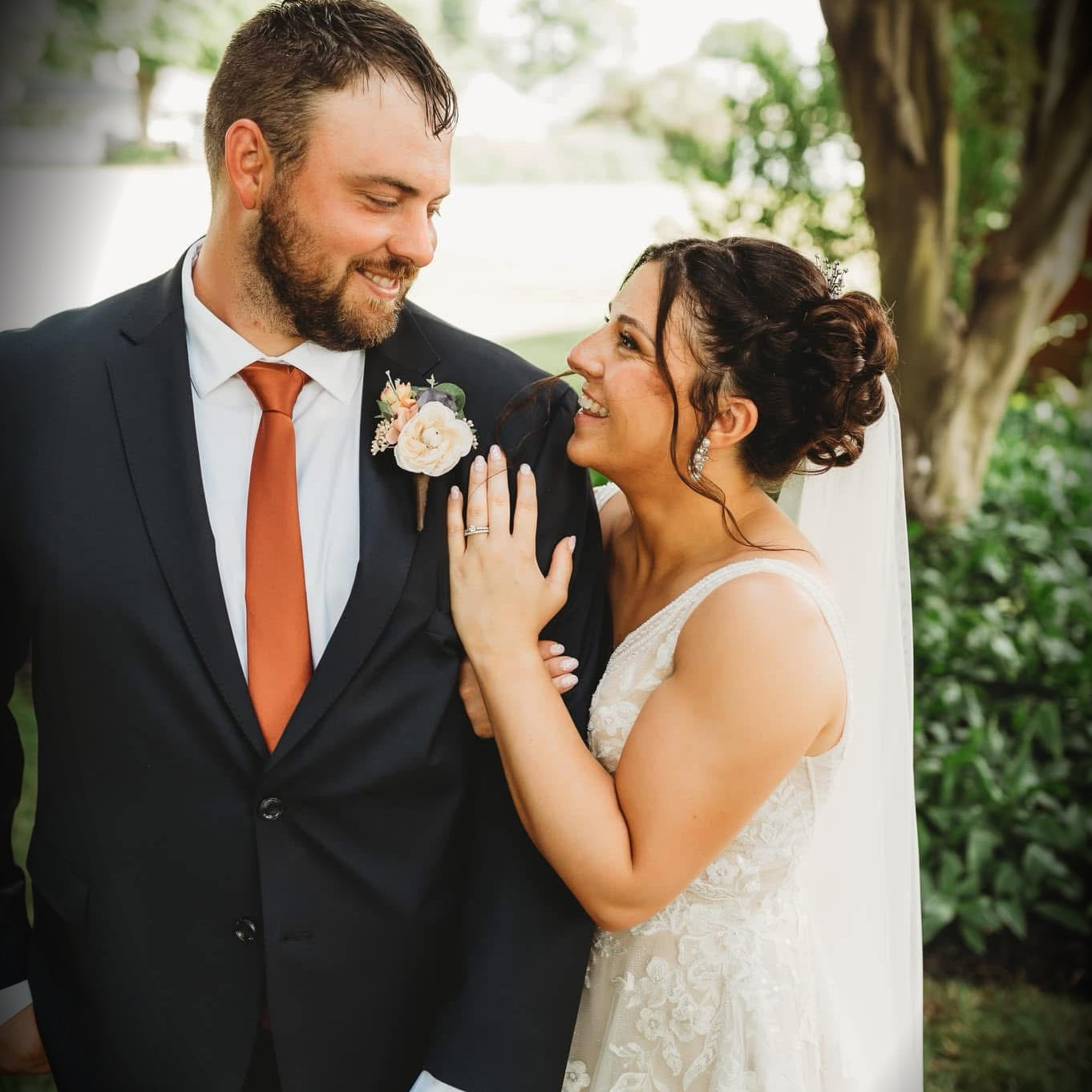 Terracotta necktie for men’s tie for wedding showcased by bride and groom.