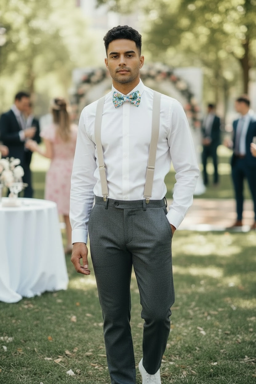 Groomsman Wearing Dusty Blue Wildflower Bow Tie and Tan Suspenders Set with White Shirt for Wedding Party Attire Coordination