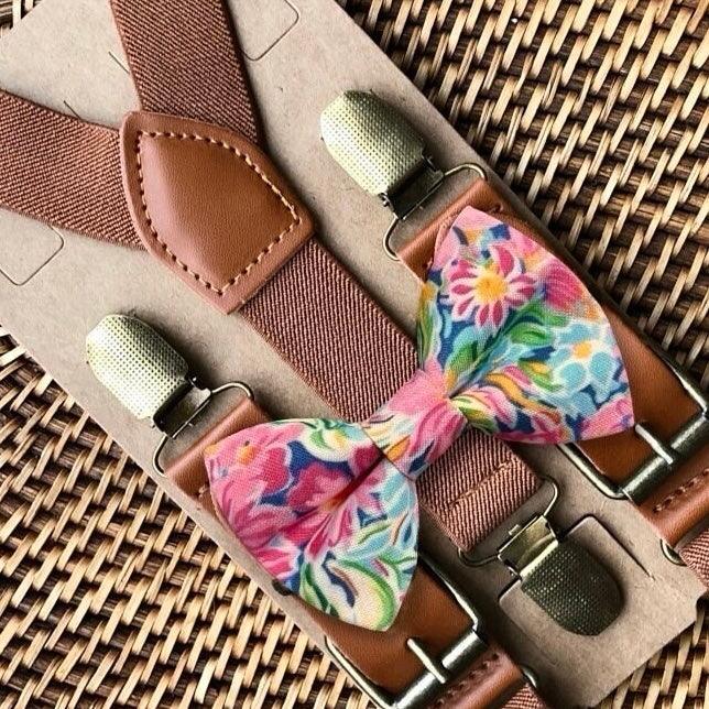 Size chart for suspender and bow tie sets from The Bold Bow Tie. X-Small (6mo-4yr): 15"-23" suspenders, 3.5" bow. Small (5-9yr): 18"-33" suspenders, 3.5" bow. Medium (10-12yr): 18"-33" suspenders, 4" bow. Adult (13yr-6'5"): 30"-53" suspenders, 4.5" bow. Big & Tall (Over 6'5"): 53"+ suspenders, 4.5" bow. Instructions note to measure from the back waistband over the shoulder to the front waistband for a comfortable fit.