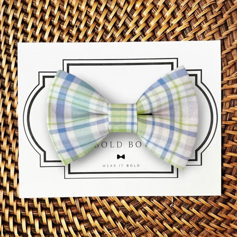 Pastel plaid bow tie for dogs or cats in purple and green displayed on a white card.