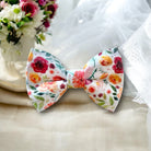 Floral bow tie for ring bearer outfits and groomsmen in a wedding.