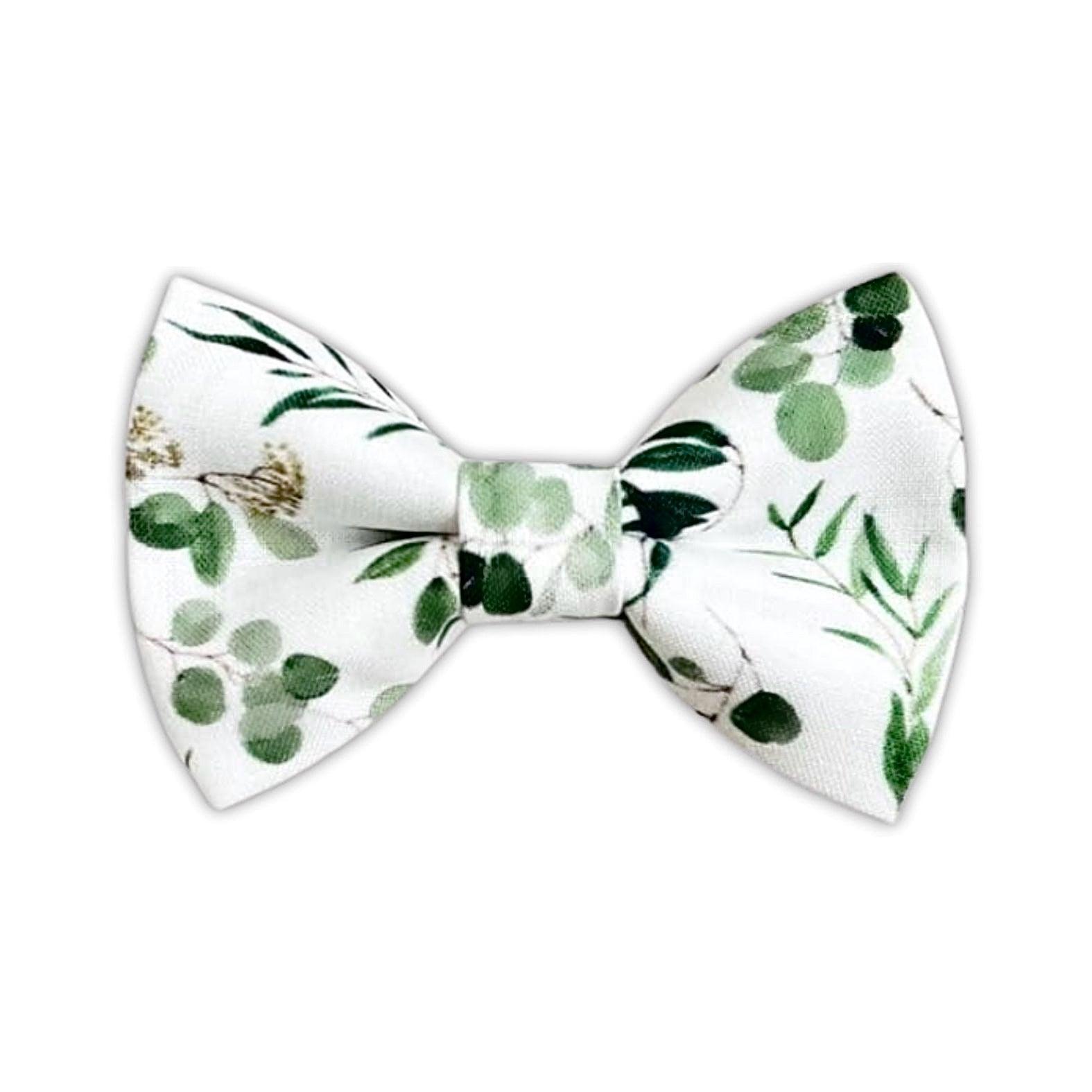 A dark green floral bow tie for men on a white background.