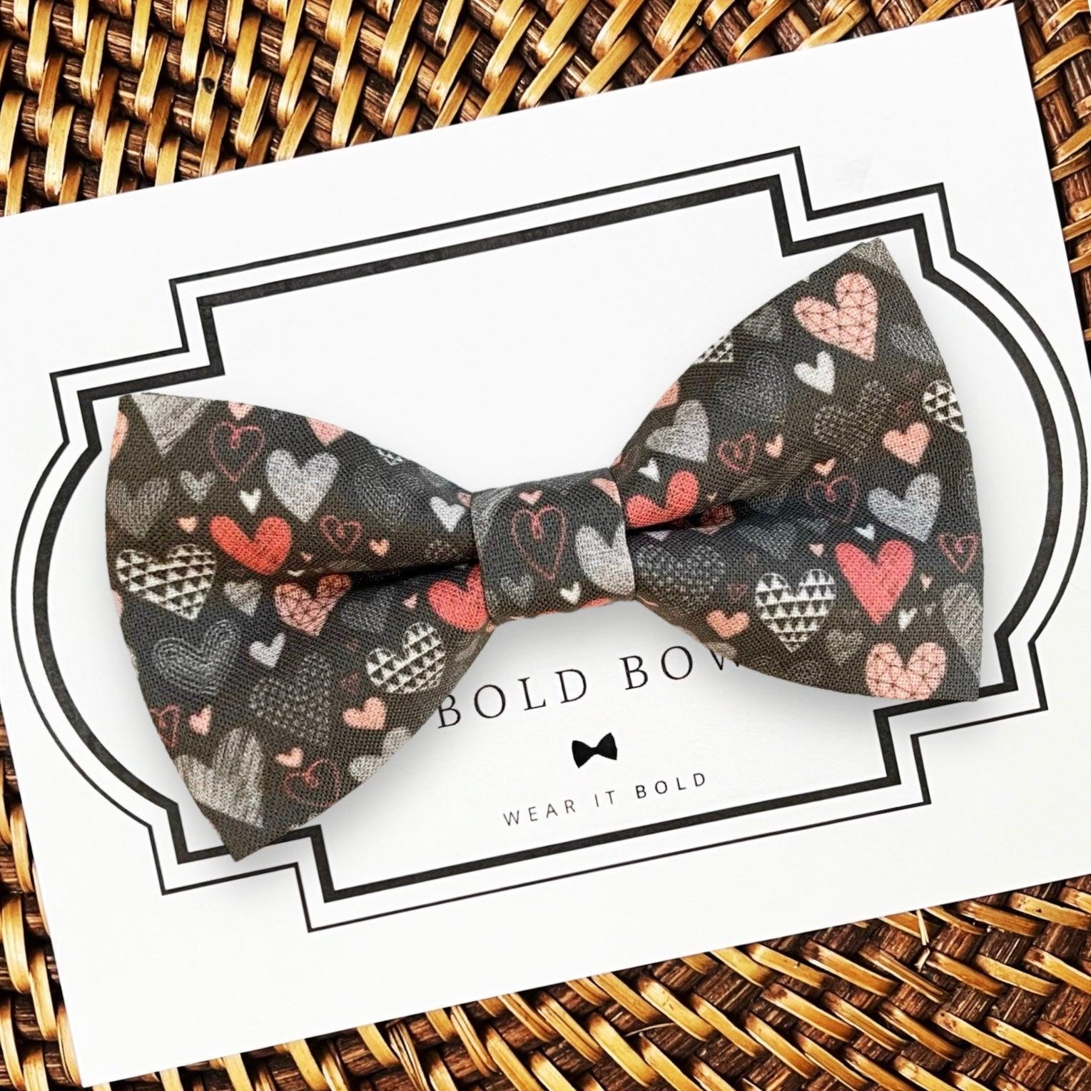 Valentine heart patterned dog bow tie displayed on a white card