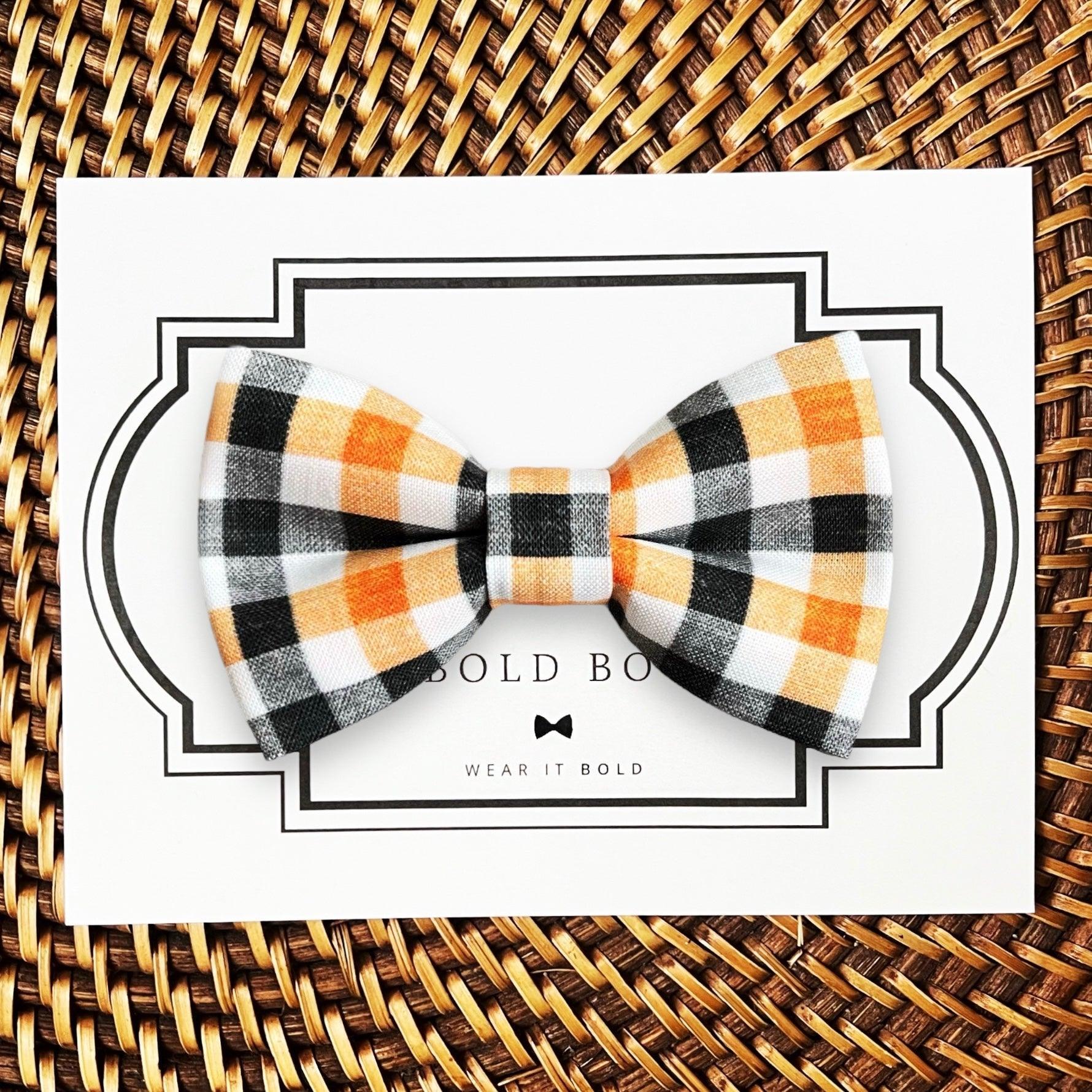 Dog bow tie size chart. Size Small is 3 1/2 inches wide for small dogs under 15 lbs. Size Medium is 4 inches wide for medium dogs between 15 band 40 lbs. Size Large is 4 1/2 inches wide for Large Dogs between 40 band 80 lbs. Size Extra Large is 5 1/2 inches wide for Extra Large Dogs over 80 lbs. Sizing is up to preference and pet bow ties slide on to dog collars with elastic.