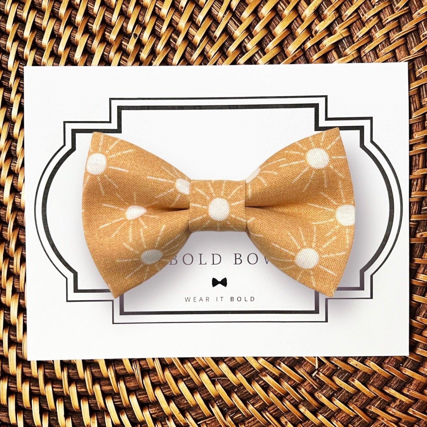 Dog bow tie size chart. Size Small is 3 1/2 inches wide for small dogs under 15 lbs. Size Medium is 4 inches wide for medium dogs between 15 band 40 lbs. Size Large is 4 1/2 inches wide for Large Dogs between 40 band 80 lbs. Size Extra Large is 5 1/2 inches wide for Extra Large Dogs over 80 lbs. Sizing is up to preference and pet bow ties slide on to dog collars with elastic.