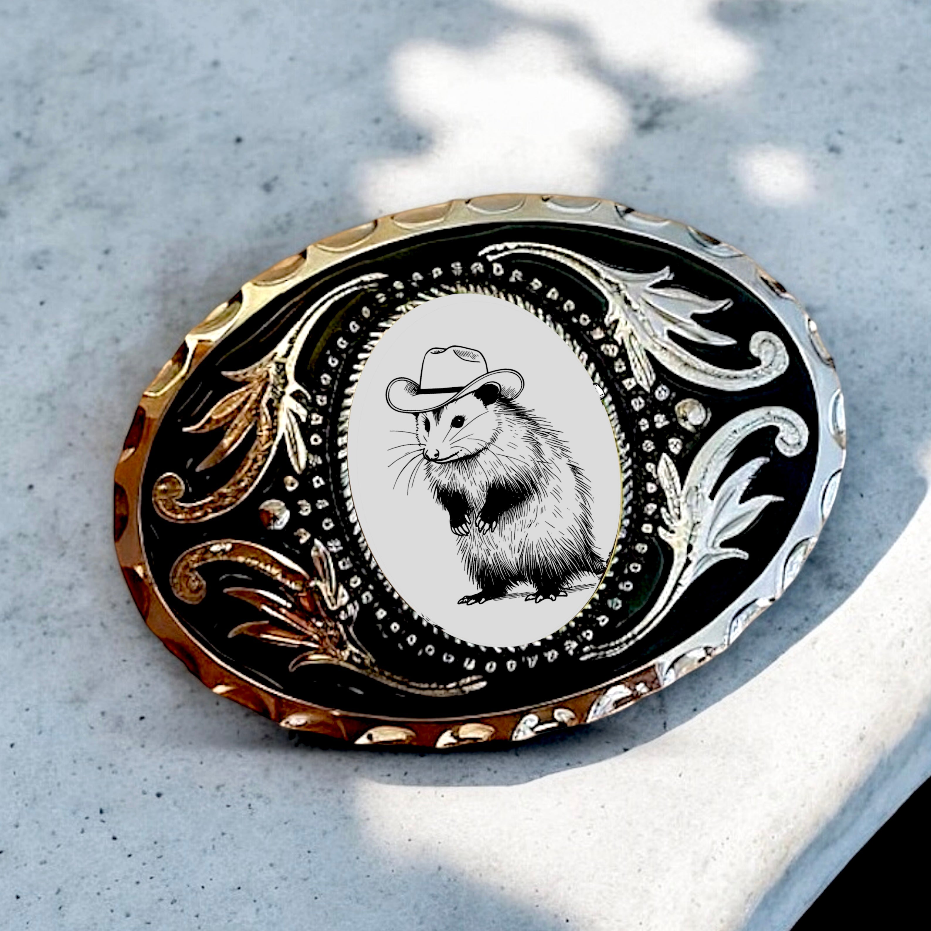 Opossum belt buckle in black white and silver.