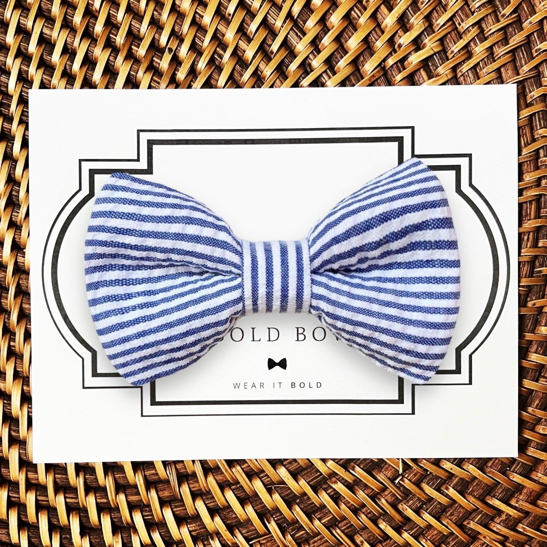 Dog bow tie size chart. Size Small is 3 1/2 inches wide for small dogs under 15 lbs. Size Medium is 4 inches wide for medium dogs between 15 band 40 lbs. Size Large is 4 1/2 inches wide for Large Dogs between 40 band 80 lbs. Size Extra Large is 5 1/2 inches wide for Extra Large Dogs over 80 lbs. Sizing is up to preference and pet bow ties slide on to dog collars with elastic.