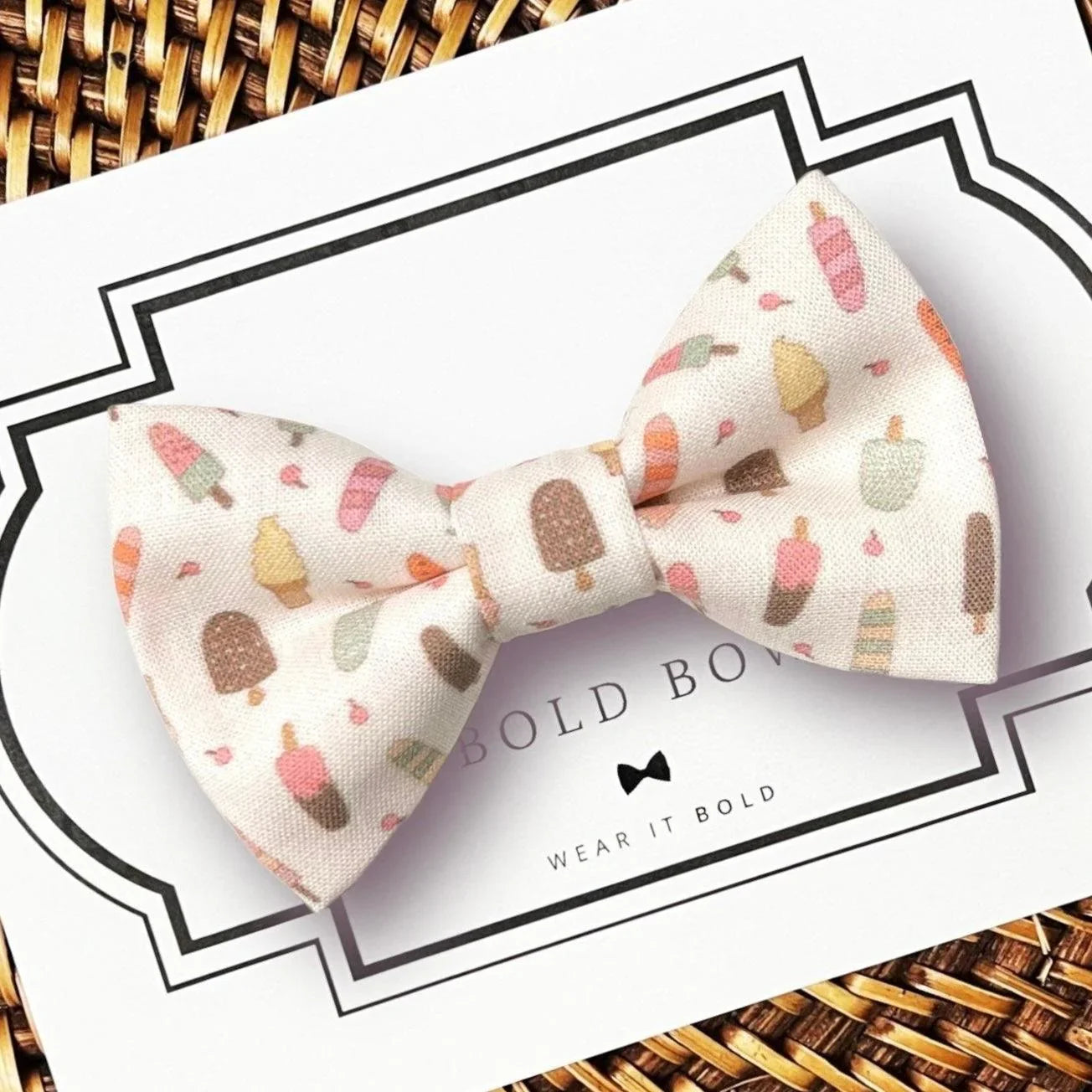 Dog bow tie size chart. Size Small is 3 1/2 inches wide for small dogs under 15 lbs. Size Medium is 4 inches wide for medium dogs between 15 band 40 lbs. Size Large is 4 1/2 inches wide for Large Dogs between 40 band 80 lbs. Size Extra Large is 5 1/2 inches wide for Extra Large Dogs over 80 lbs. Sizing is up to preference and pet bow ties slide on to dog collars with elastic.