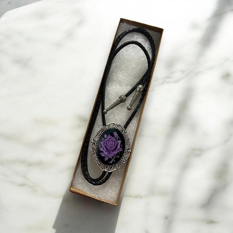 Bolo Tie- Black & Purple Rose on silver bezel with black leather cord displayed in a gift box.