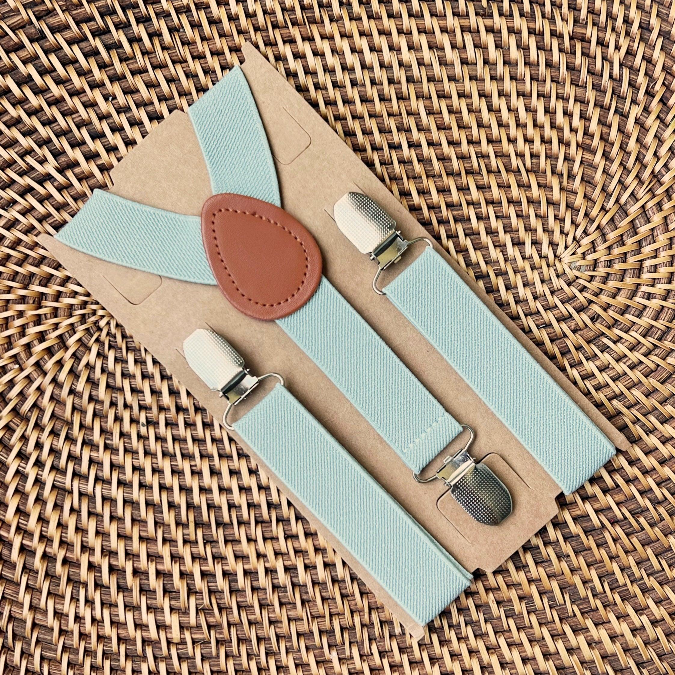 Sage Green Suspenders Leather Accents Metal Clips Earthy Tone Groomsmen Wedding Accessory Adjustable Elastic Straps Mens Formalwear Flat Lay Backdrop