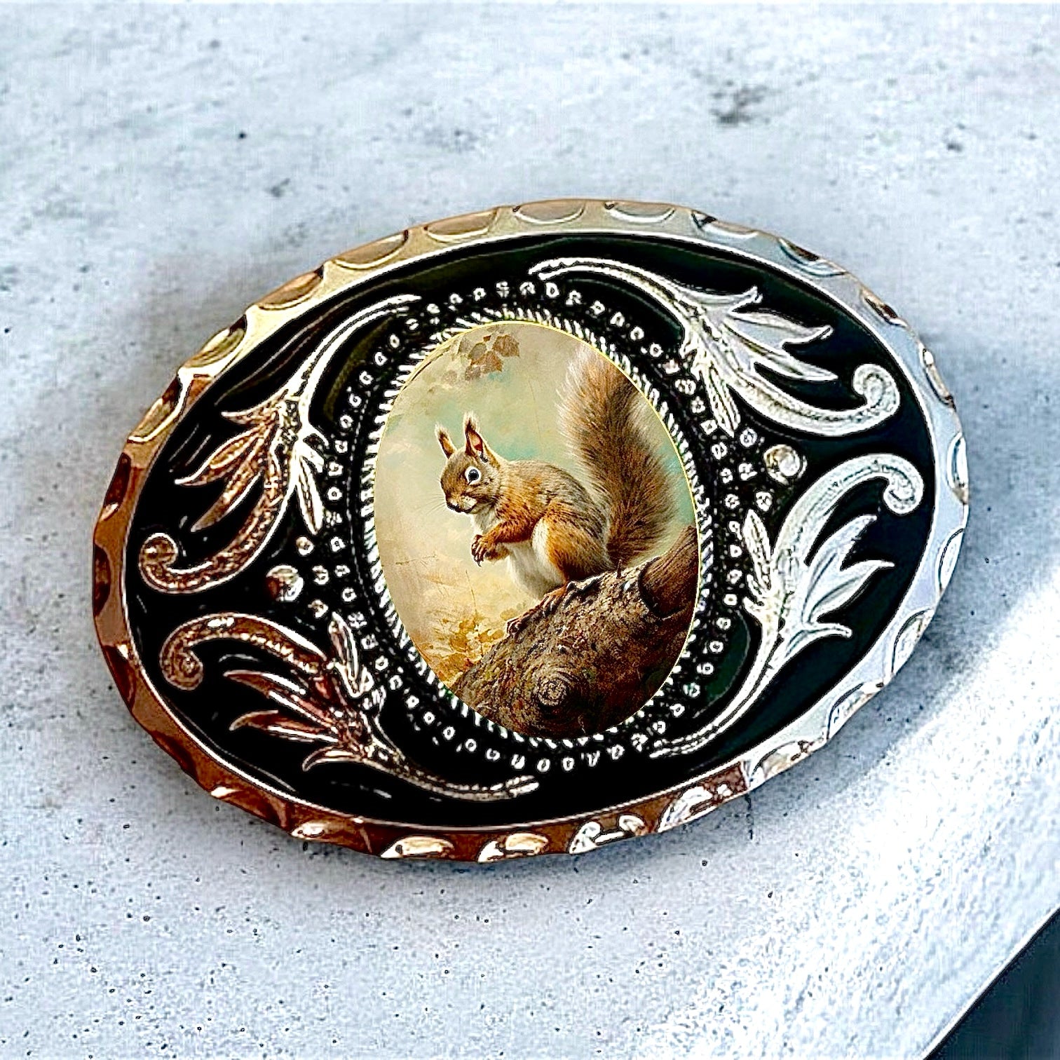 Squirrel Belt Buckle Cowboy Western Accessory on marble table